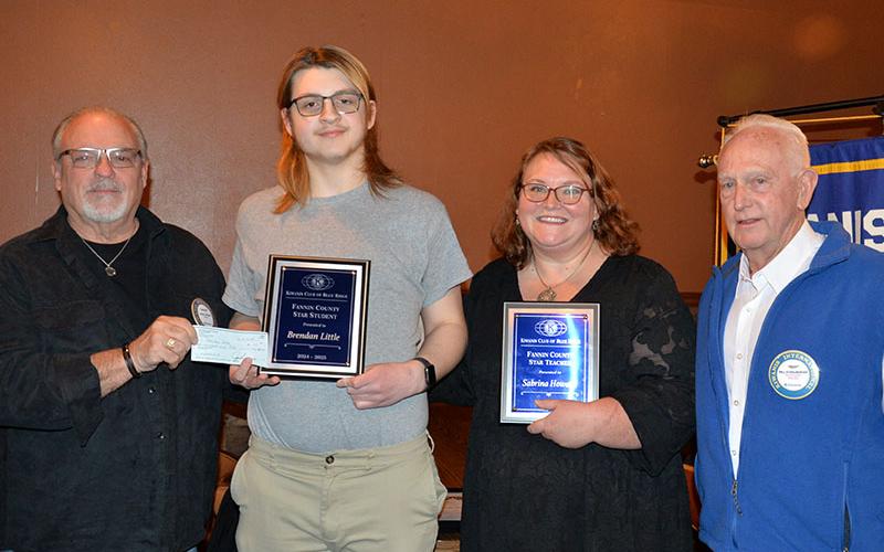 Blue Ridge Kiwanian Jessie Pinson, left, presents a check to STAR Student Brendan Little during a banquet Monday, February 3. They are shown alongside STAR Teacher Sabrina Howard and Blue Ridge Kiwanian Bill Echelberger.