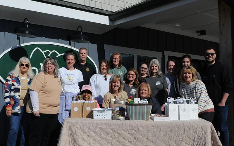 Volunteers for the vaccine clinic sponsored by Fannin County Barking Buddies, Cohutta Animal Clinic, Blue Ridge Animal Control, and Force-Free Dog Trainer are shown left to right, front; Marge Heald, Tina Lacombe, Sue Peet, Jonathan Chambers, Donna Turek, Meri Taylor, and Sandy Taylor, top; Fannin County Animal Control Officer Luke McDonald, Dr. Grace Murray, Sandy Figueroa, Grace Haberman, Asheton Bradley, Teresa Hughes, Emma Groll, and Dr. Will Patterson.