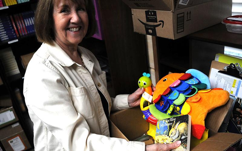 Bev Cook, the coordinator for The Craddock Center’s Smart Babies program, shows toys children can get from the program.