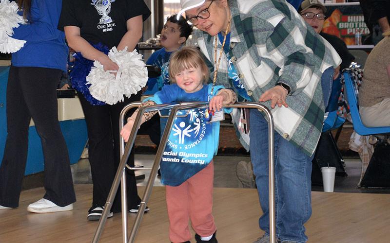 Kora Keller from Blue Ridge Elementary gets help from paraprofessional Patsy Wood.