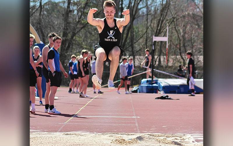 Fannin County’s Cooper Hilliard gets good distance in long jump competition against Pickens County.