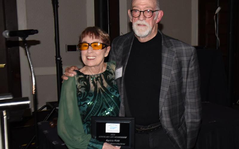 Mike Lacy congratulates Pat Webb for her Lifetime Membership award.