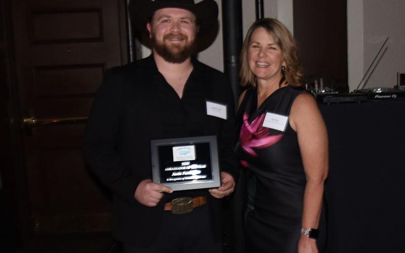 Justin Farrington accepted his award from Char Stacy.