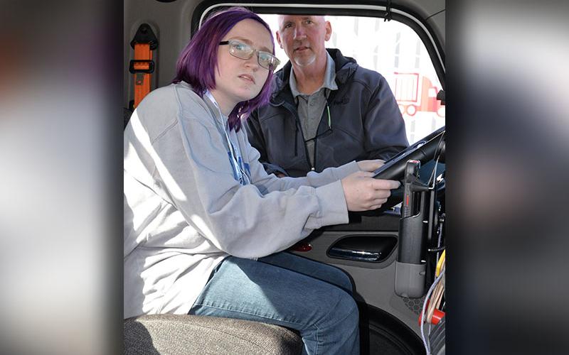 Jay Kenniff learns why drivers should be so careful around 18-wheelers from David Young of FedEx Freight. Kenniff is looking to see what is visible through the rear view mirror, and the blind spots other drivers should respect.