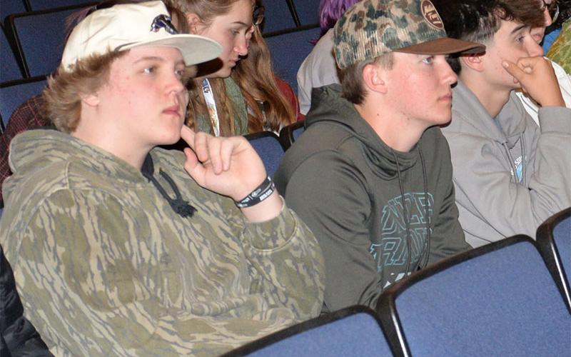 Easton Matnis, Nate O’Neal and Corbin Head, from left, hear the penalties they would face if they were driving and someone died in a car crash they caused.