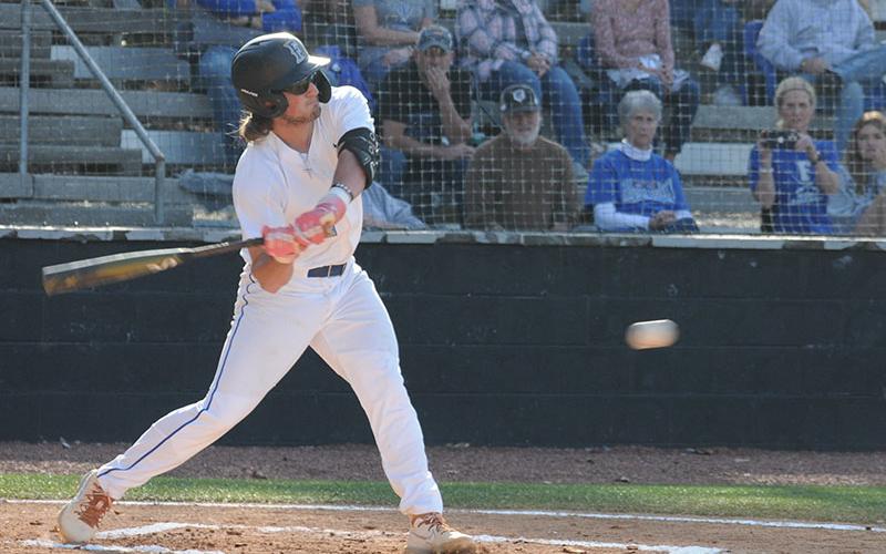 Rebels senior Colton Gray swings at a ball in an April 1 game against Gordon Lee.