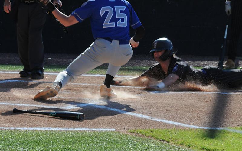 Rebels Senior Colton Gray slides into home during an April 15 game against Gordon Central.