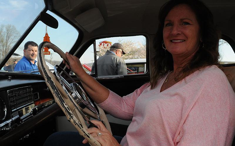 Donna Neal sits in the driver’s seat of the 1949 Plymouth her mother owned as a young woman.