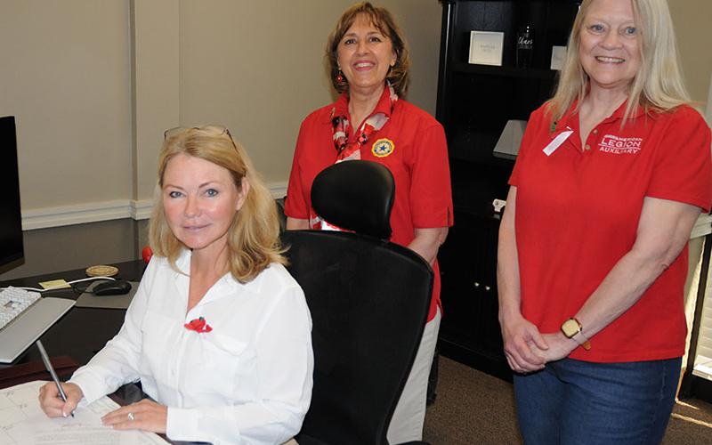 The City of Blue Ridge issues a proclamation Wednesday, April 16, for National Poppy Day. From left, mayor Rhonda Haight, American Legion Auxiliary president Leslie Callender and American Legion Auxiliary vice presidential nominee Starr Glisson-Smith.