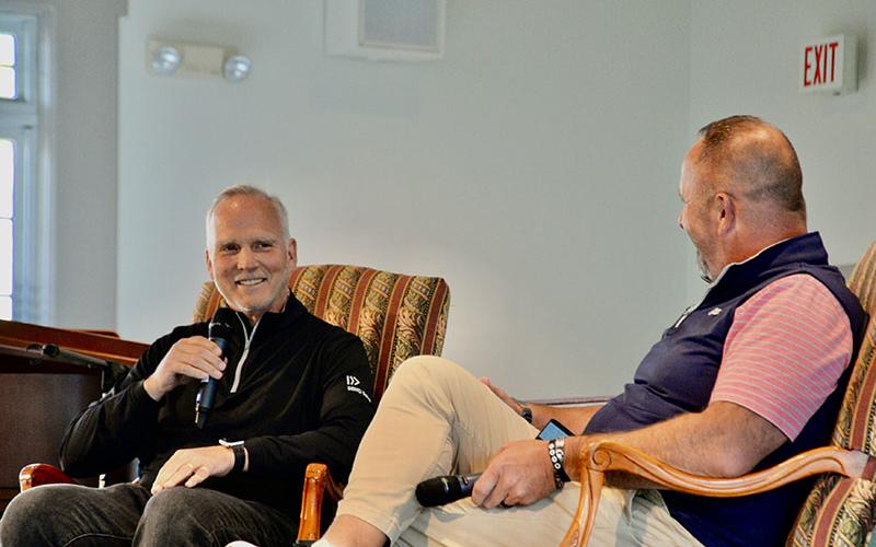 Coach Mark Richt, left, entertains the crowd gathered at Morganton Baptist Church Tuesday, April 22, for the 515 Fellowship of Christian Athletes fundraiser. He is shown in conversation with North Georgia FCA Director Clint Fair.