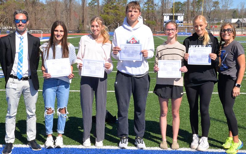 Six Fannin County High School Cross Country athletes were named to the 2024 Rome All Area High School Cross country Team. Shown, with their coaches, are, from left, Coach Dr. Lucas Roof, Karli Sams, Linsdey Holloway, Rylin Davis, Sydney Ford, Kensley Pickelsimer, and Coach Miranda Roof. Not pictures is Lila Borum.