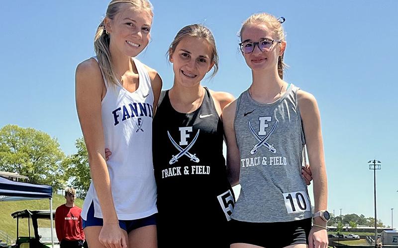 Lindsey Holloway, Karli Sams and Sydney Ford, from left, celebrate after the Etowah Invitational.