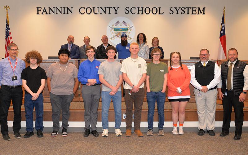 Fannin County High School TSA members, from left, front, CTAE teacher Parry Ruder, Chevy Phillips, Kevin Tzun, James Burrell, Kyle Conner, Aiden Carder, Castle Barnett, Fox Sharp, CTAE Supervisor David Henson and Principal Dr. Scott Ramsey; back, board members, Chairman Mike Cole, Bobby Bearden, Adam Born, Robert Patterson, Ashley Herendon-Weeks and Superintendent Shannon Dillard.
