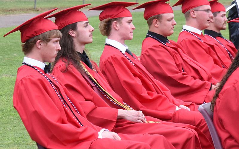 Copper Basin High School graduates, from left, Mason Anderson, Klayton Jory, Talon Smith, Zackery Beach, Anthony Bledsoe and Hayden Deal wait to received their diplomas Thursday evening on the school’s football field.