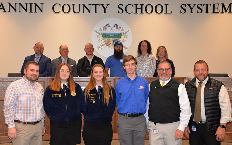 Fannin County High School FFA members were recognized at the Board of Education’s April 10 meeting. Shown are, from left, front, FFA Advisor Seth Davis, Skylar Gazaway, Abigail McFarland James Burrell, CTAE Supervisor David Henson and Principal Dr. Scott Ramsey; back, board Chairman Mike Cole and board members Bobby Bearden, Adam Born, Robert Patterson, Ashley Herendon-Weeks and Superintendent Shannon Dillard.