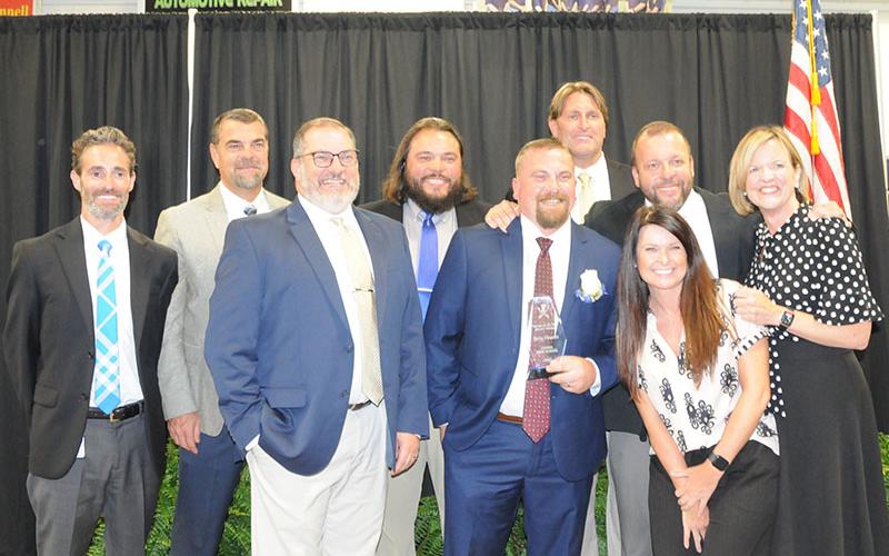 Fannin County High School welding instructor Terry Flowers was honored Tuesday, May 13, as the Fannin County School System’s Teacher of the Year. Celebrating his award are, from left, Dr. Lucas Roof, Darren Danner, David Henson, Jeremy King, Flowers, Alan Collis, Dr. Scott Ramsey, Amanda Housley, and Shannon Dillard.