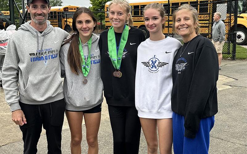 Coach Lucas Roof, Karli Sams, Lindsey Holloway, Sydney Ford and Head Coach Miranda Roof, from left, celebrated the Lady Rebels Track &amp; Field victories following competition at Rome last Friday and Saturday.