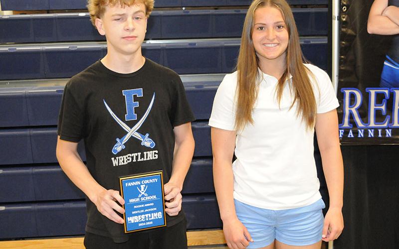 Wrestling team members Bentlee Jackson, left, and Bridgett Allen receive Rookie awards April 28.