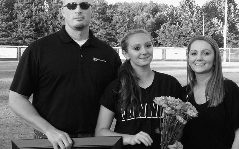 Candace German is shown with her parents during the Fannin County Lady Rebels senior night recognition. She played varsity softball for four years, beginning with the 2009 season and ending when she was a senior.