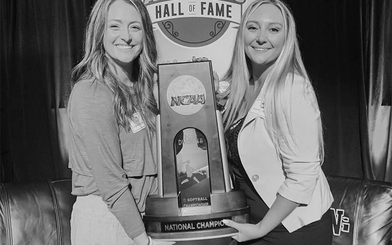 Candace German and Alexis Collis O’Neal show off the 2015 North Georgia National Championship trophy.