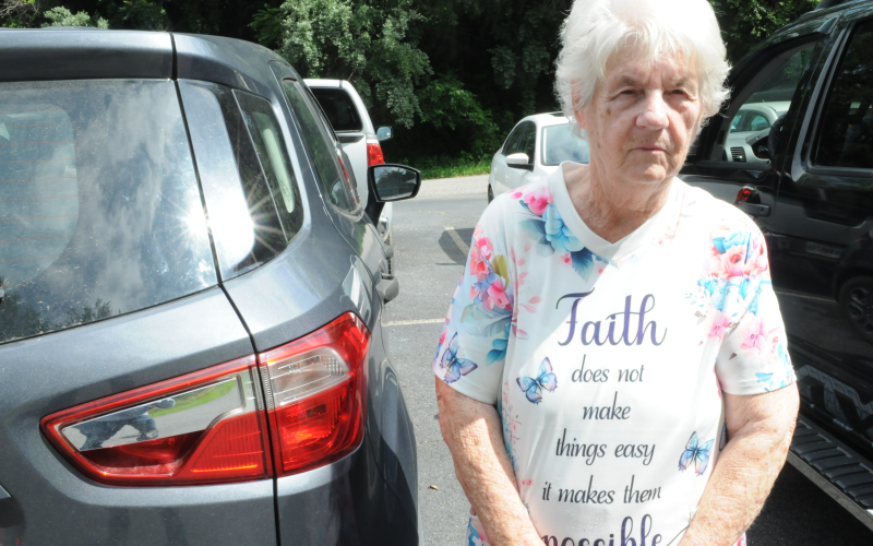 Willie Burnett gets food she needs for her family from the Morganton Mountaintown Baptist Association.
