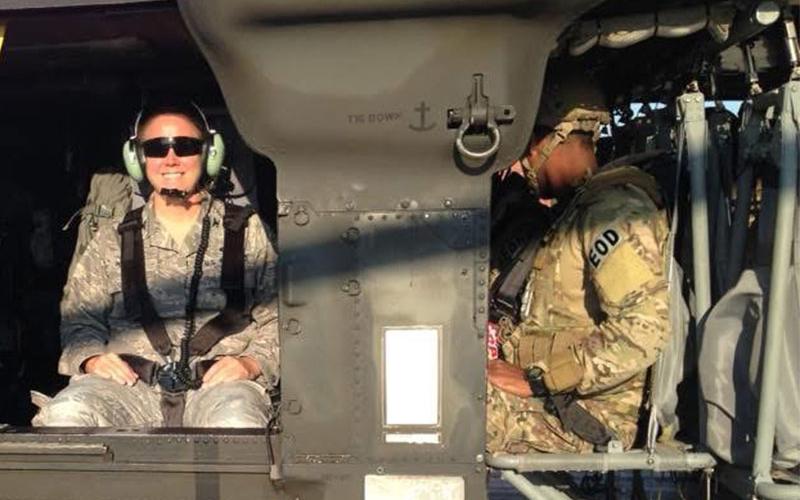 Lori Walden prepares to take a helicopter flight while her airmen are training.