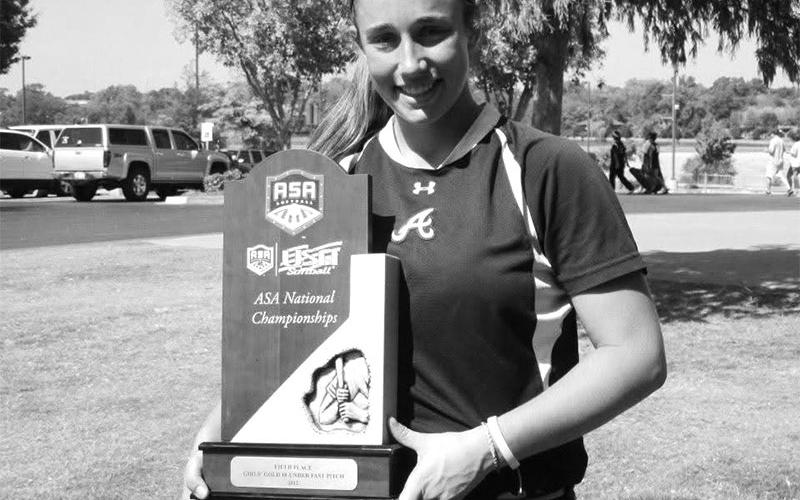 After high school, Karly Thompson played for the Atlanta Vipers during the summers of 2012 and 2013. She is shown with the National Championship trophy the team won in 2013.