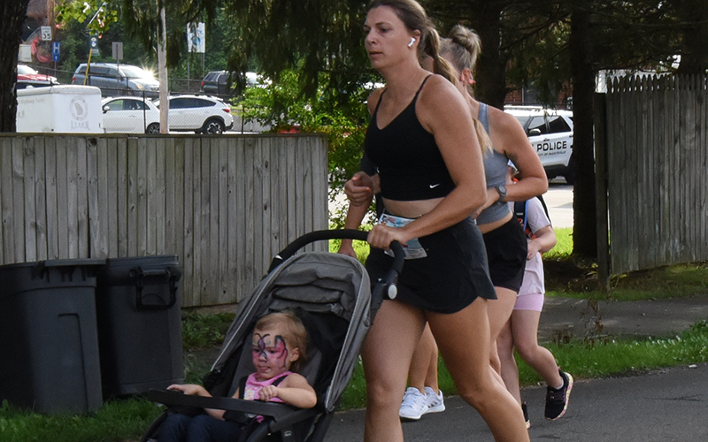 This youngster sat back and enjoyed the ride, being pushed through the Walk the Line 5k in McCaysville/Copperhill July 19.