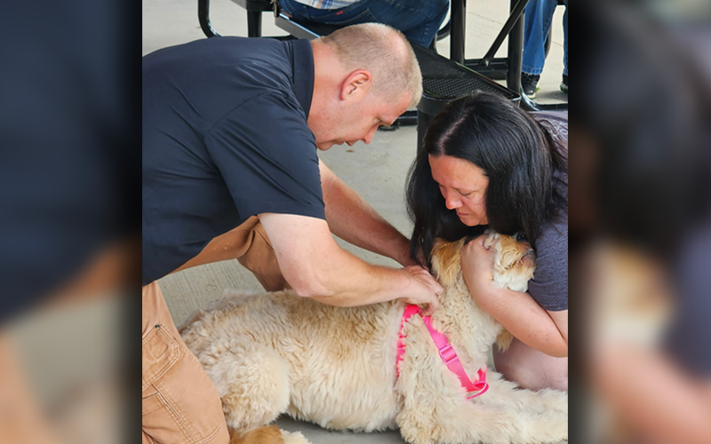 Officer Luke McDonald of Fannin County Animal Control is shown inserting a microchip into a dog at a free microchipping event at Toccoa River Park in McCaysville  June 28.