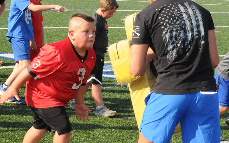 Blocking drills were part of last week’s youth football camp.