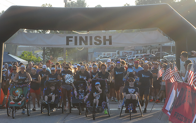 Gunner Patterson, Aiden Mullins, Lilly Kicklighter, Brady Smith and Ethan Kicklighter, from left, start their race in the Blue Ridge Freedom 5K.