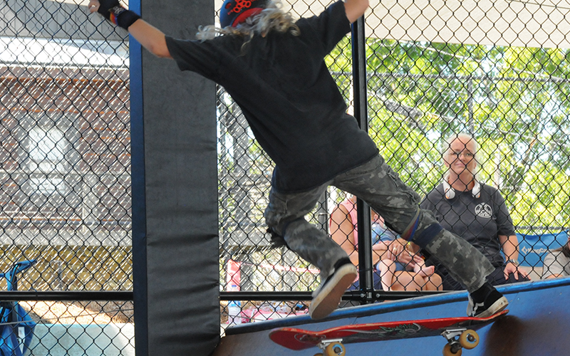 News Observer Photo/Jackson Elliott At Highland Outdoor Ministry’s Shred Fest, Moses Hart rides down a ramp.