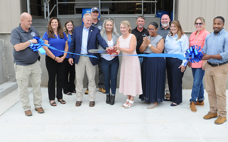 Blue Ridge public servants and others cut the ribbon at the Blue Ridge Wastewater Treatment Facility. Seen, from left, are Project Manager Denny Cook, Utilities Director Rebecca Harkins, Chrissy Garrison of Carter and Sloope, Representative Johnny Chastain, Plant Superintendent James Weaver, Council Member Christy Kay, Mayor Rhonda Haight, Shane Lawson of Carter and Sloope, Jamelle Cherry with Georgia Environmental Finance Authority (GEFA), Matt Smith of Carter and Sloope, Susan Lucki of GEFA, Lori Moore wi