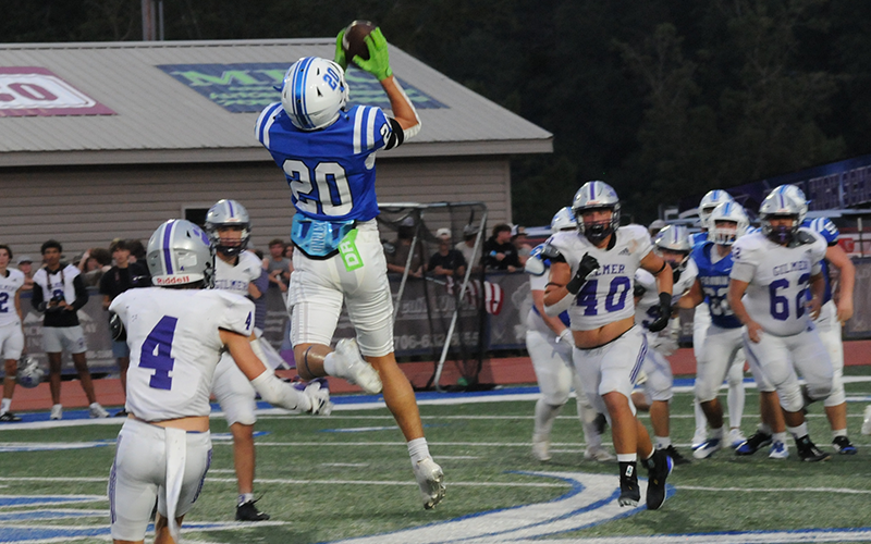 Fannin County’s Braxton Cheatham goes up to pull down a pass for the Rebels against Gilmer County.