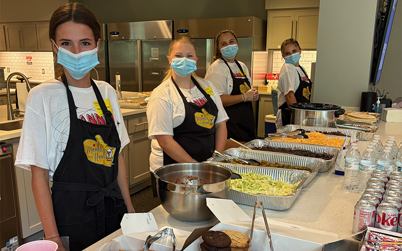 Adeline Beavers, Lyla Webb, Fannin County High School paraprofessional Maddie Mitchum, and Eleanor Hodgson, from left, served a meal at the Ronald McDonald House in Atlanta as part of a Family Career and Community Leaders of America project. The meal included cookies donated by the Sweet Shoppe of the South.
