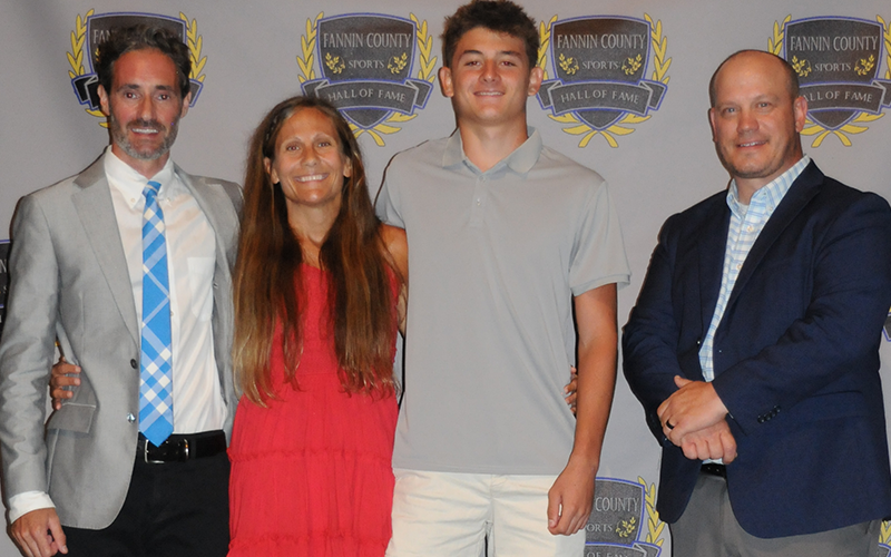 Braxton Cheatham received Fannin County Sports Hall of Fame recognition as Most Valuable Athlete in track and field. Shown with Cheatham are Coach Dr. Lucas Roof, Coach Miranda Roof, Cheatham, and Hall of Fame President Adam Born.