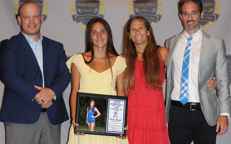 Female Athlete of the Year Karli Sams is shown with, from left, Fannin County Sports Hall of Fame President Adam Born, Sams, and coaches Miranda Roof and Dr. Lucas Roof.