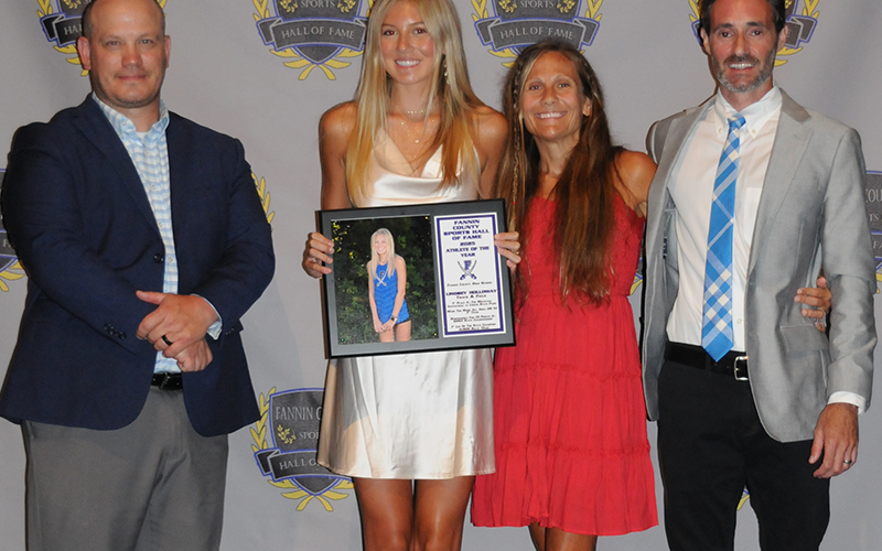 Female Athlete of the Year Lindsey Holloway was honored at the Fannin County Sports Hall of Fame Banquet by, from left, Hall of Fame President Adam Born, Holloway, Coach Miranda Roof and Dr. Lucas Roof.