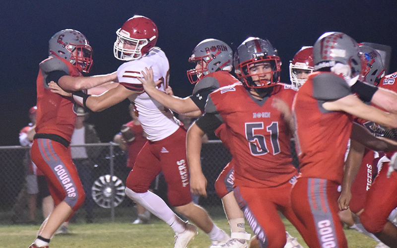 Drew Crowder (6), Logan Cochran, Thomas Seabolt (51) and Darrius Harris work to hold back the Whitwell defense in action Friday night at Copper Basin.