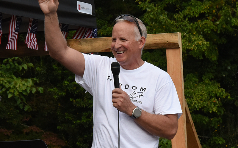 State Representative Johnny Chastain gestures to the crowd during the Fall Festival.