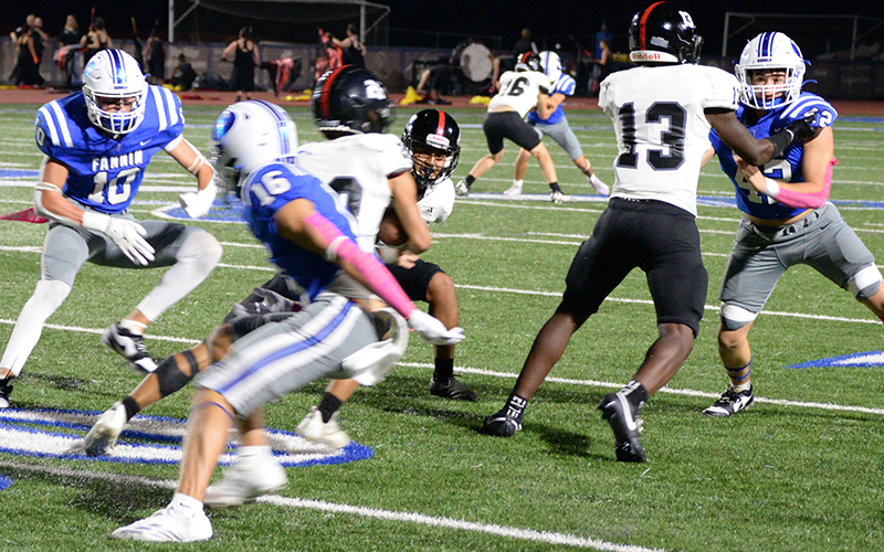 Fannin County’s Kason Brown, Brody Burnette and Casen Bailey maneuver to make a tackle in previous action this year. The trio are part of a defense whose starters held Armuchee to negative 11 yards Friday night.