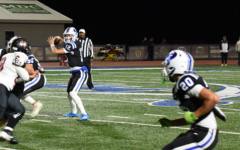 Conrad Holloway eyes Braxton Cheatham as the Fannin County Rebels looked to pick up yardage against Christian Heritage Friday night in Blue Ridge.