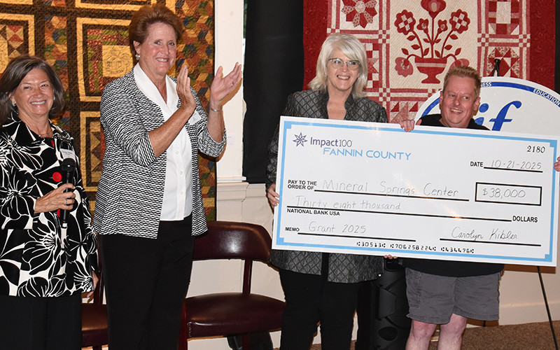 Carolyn Kibler and Kandy Kay congratulate Robin Davenport and Eric Morris, from left, on the Impact100 Fannin grant award to Mineral Springs Center.