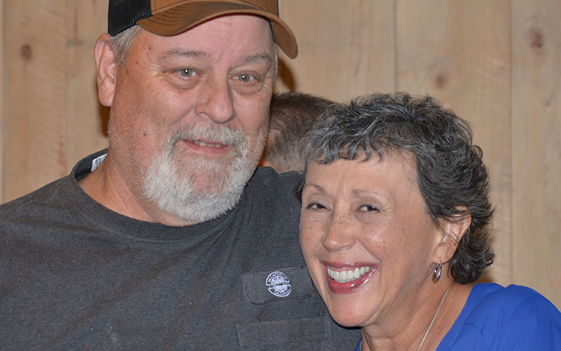 Bill Newman and Nancy Godfrey share a moment during Godfrey’s retirement reception Friday, October 24.