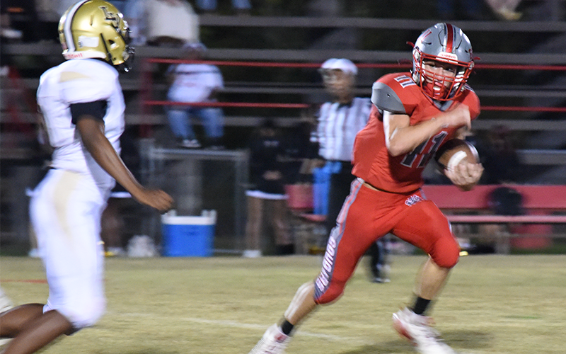 Copper Basin’s Nick Bird looks for running room against Lookout Valley Friday night.