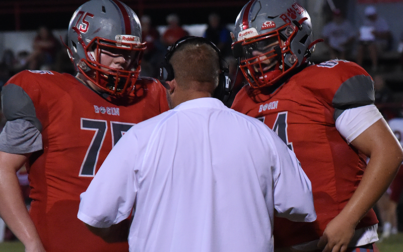 Copper Basin’s Dylan Beaver (75) and Cooper Floyd (64) get instructions during recent Cougar action.