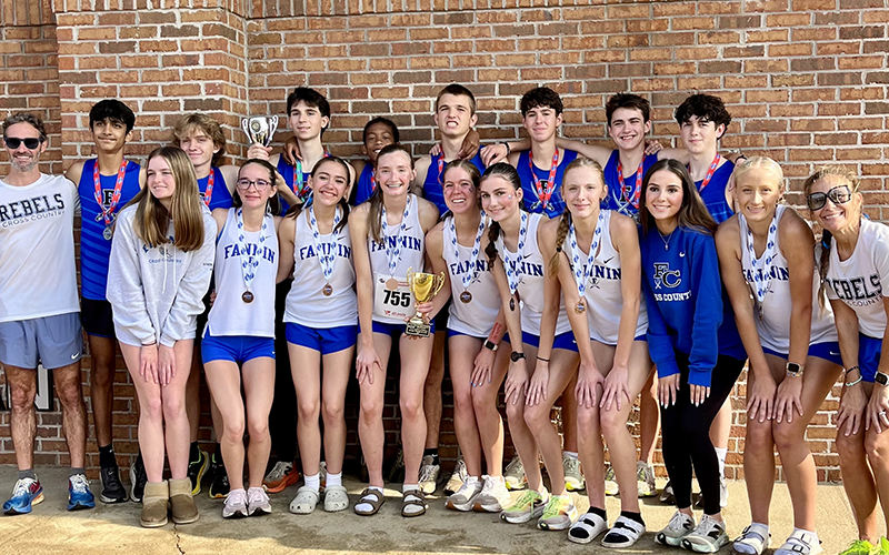 The Fannin County High School cross country boys and girls teams are shown following their successful trip to the State Championships. Shown with their awards are, from left, back row: Coach Dr. Lucas Roof, Jainil Patel, Aiden Jones, Winn Rickenbaker, Jamari Dunn, Rylin Davis, Henry Schueneman, Grey Ward, and Gabe Pirkle; and, front row, Addison Head, Sydney Ford, Charlotte Vallejo, Lola Temples, Maddie Schueneman, Garin Rickenbaker, Lana Hicks, Townson Rickenbaker, Kensley Pickelsimer,  and Coach Miranda R