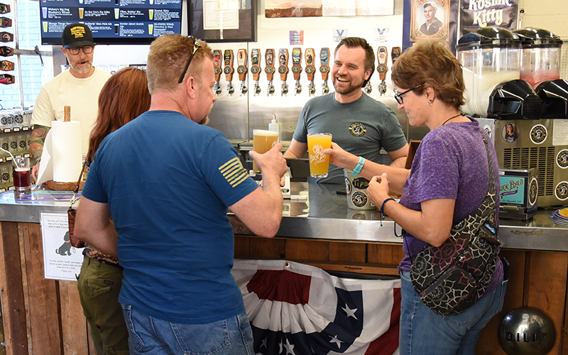 Jake Reuse serves up smiles and cold beer at Buck Bald Brewing in Copperhill. The award winning brews are favorites among the 250-plus regular customers who have joined the brewery’s Mug Club.