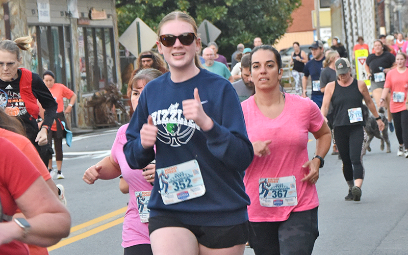 A runner gives a thumbs up as she makes her way along the Bigfoot Boogie course. 316 runners crossed the finish line this year.