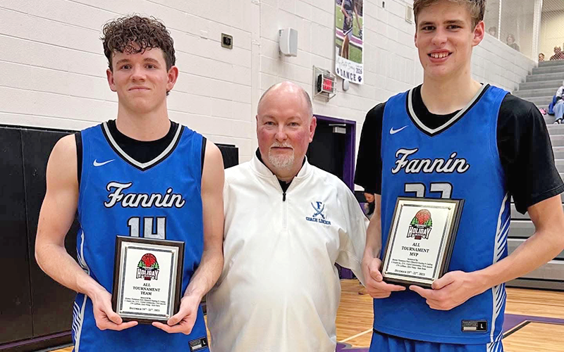 Brody Henson, left, and Kolton Kaylor, right, were both named to the Piedmont Mountainside Holiday Classic All Tournament Team. They are shown with Rebel Head Coach Greg Linder.